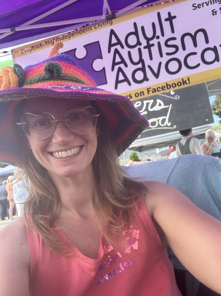 Adult Autism Advocates Worker with Banner in the background